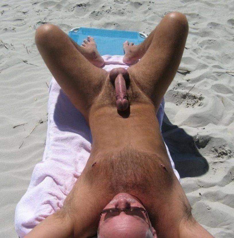 Standing penis on the beach