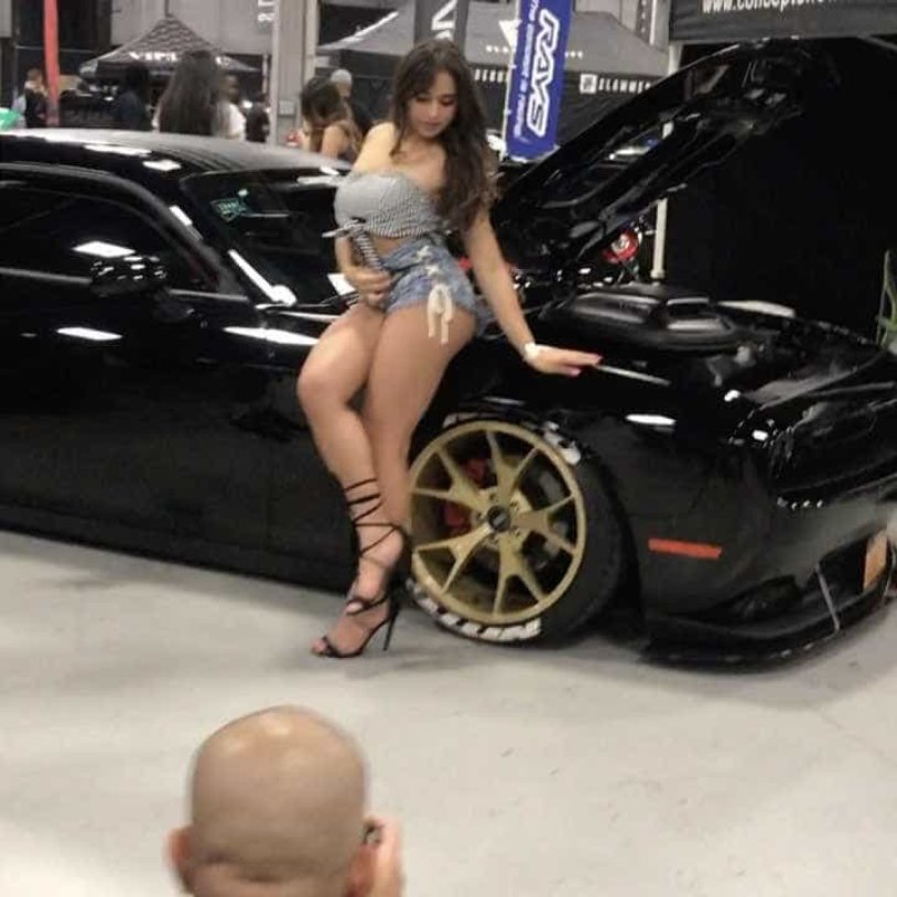 Ashley Ortis in a short dress