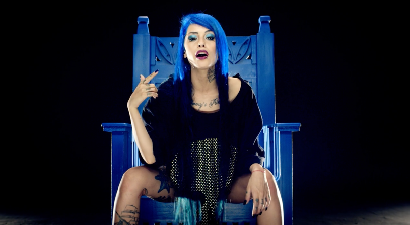 Girl in tattoos against the background of the temple