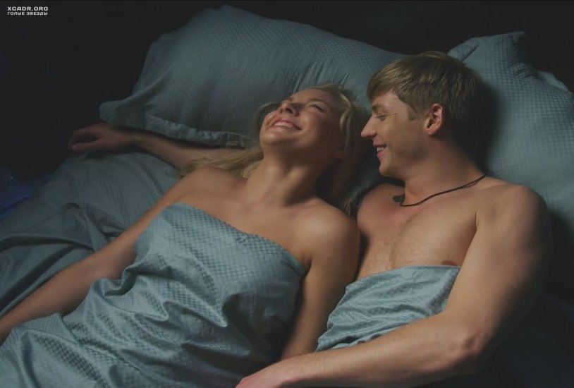 Girl in a T -shirt in bed