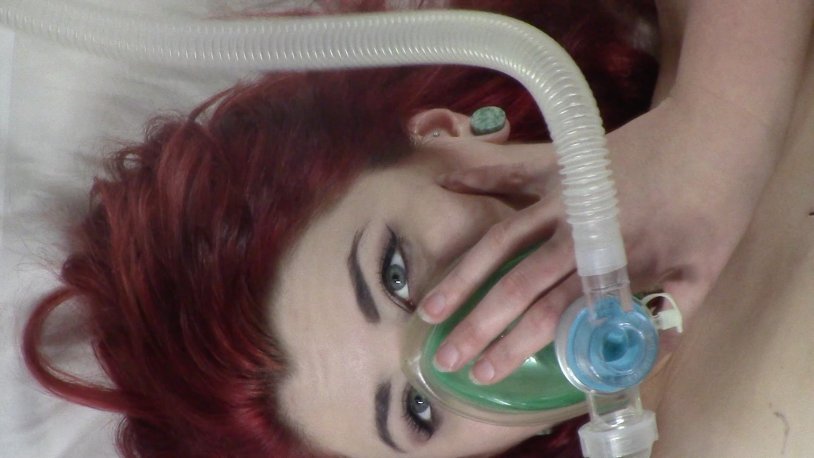Girl in an oxygen mask