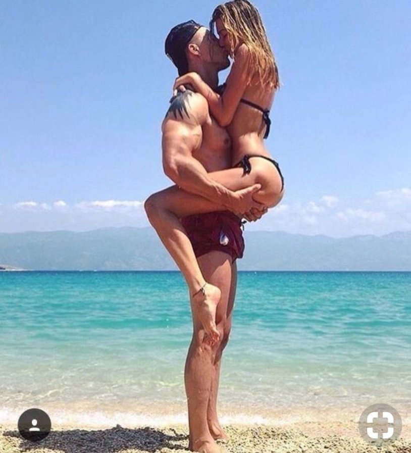 Sports couple on the beach
