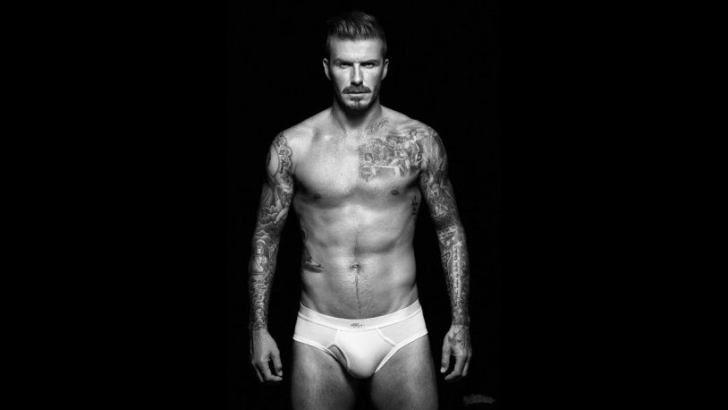 David and Victoria Beckham photo shoot on the bed