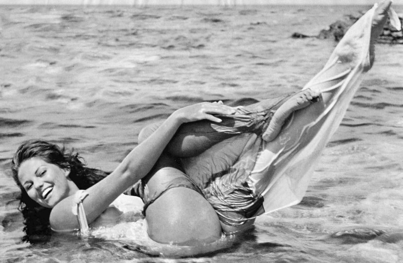 A couple in the sand by the sea