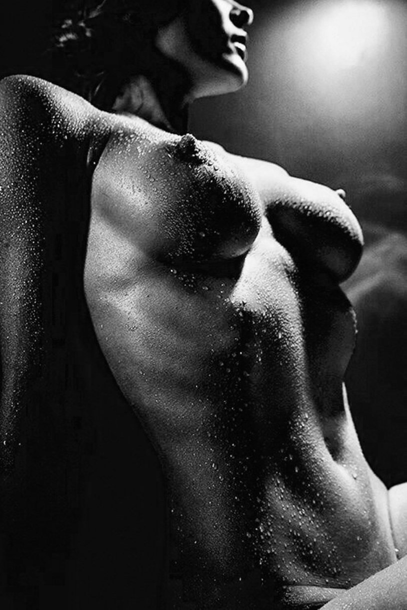 Girl from the back in the water of the nude