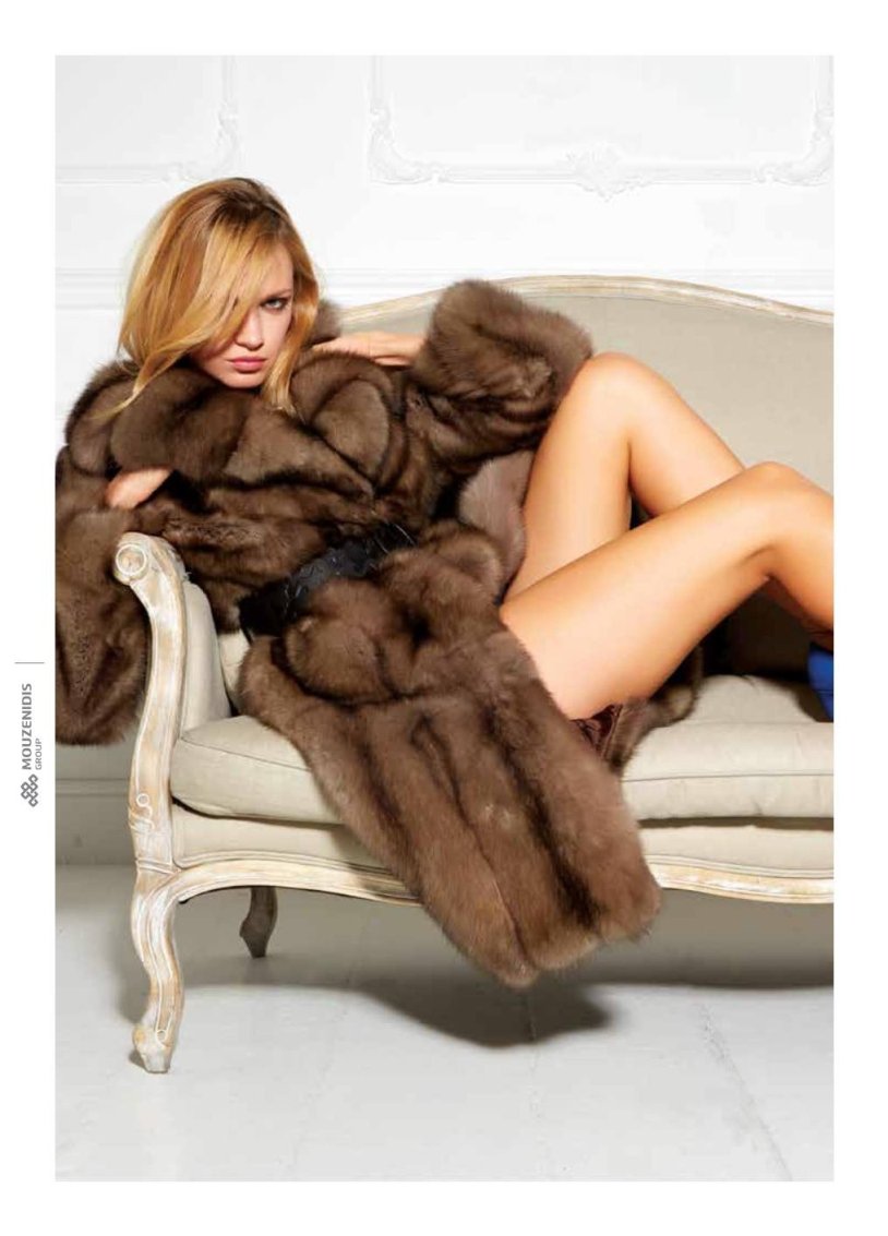 Erotic photo shoot in a fur coat