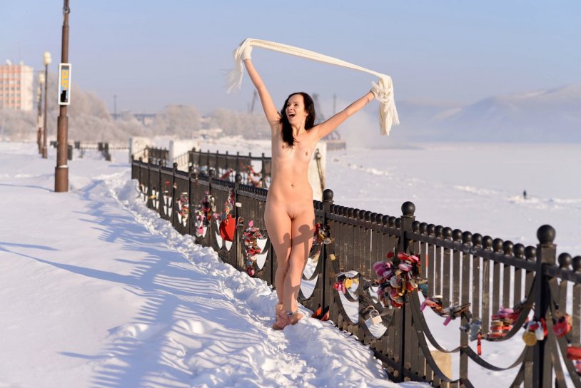 Naked blonde on the street at night