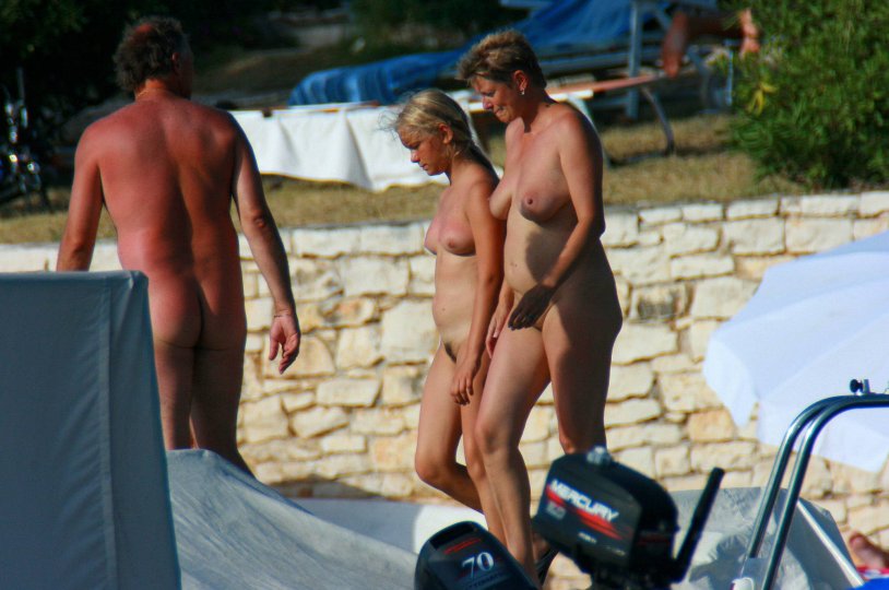 Fkk girl naked on the knees of a man hairy