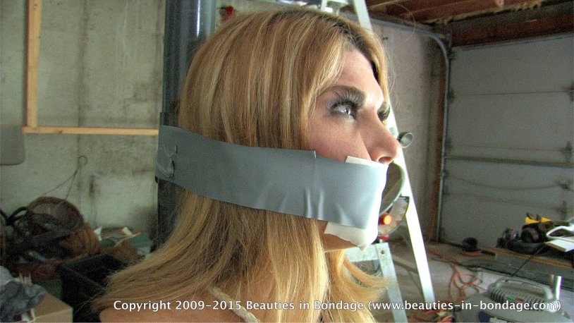 Carissa Montgomery Gagged is tied to a pillar