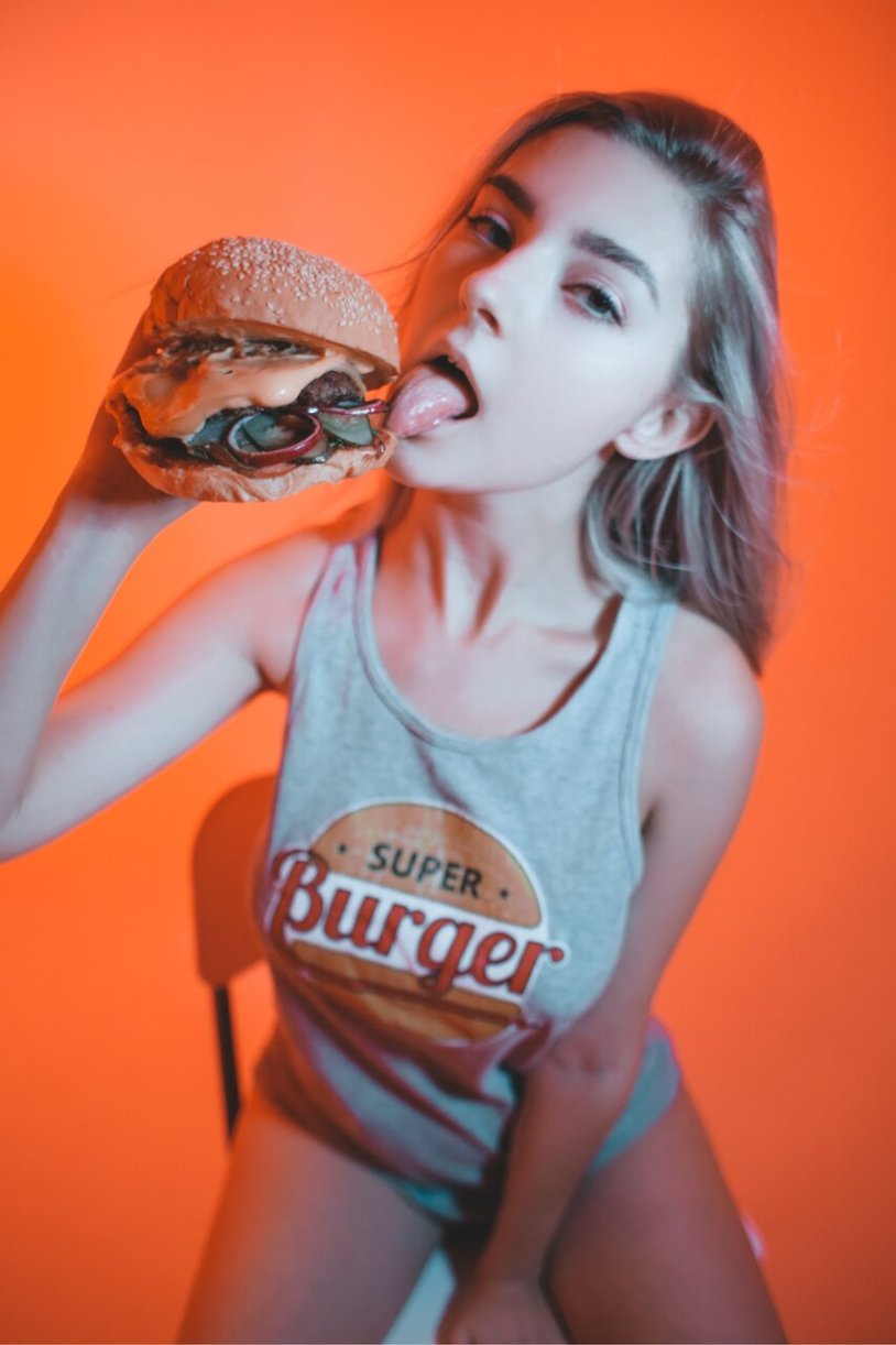 Girl eats a hamburger