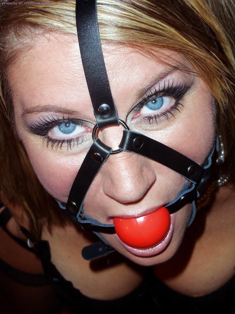 Girl in the collar and gag BDSM