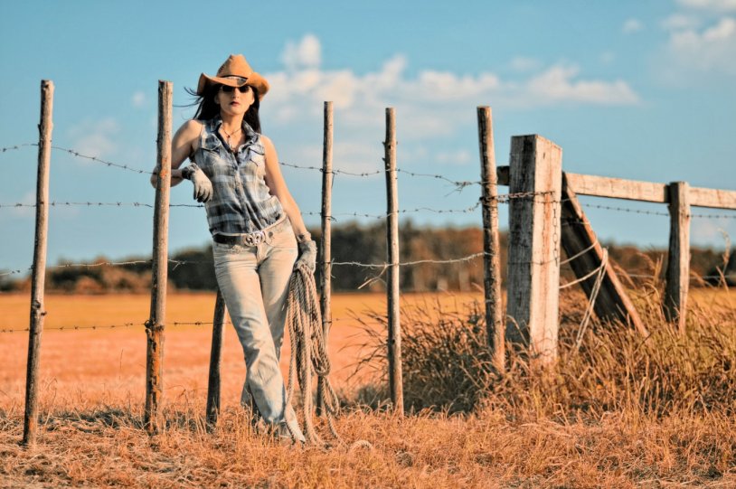 Photoshoot in a cowboy hat and a short dress