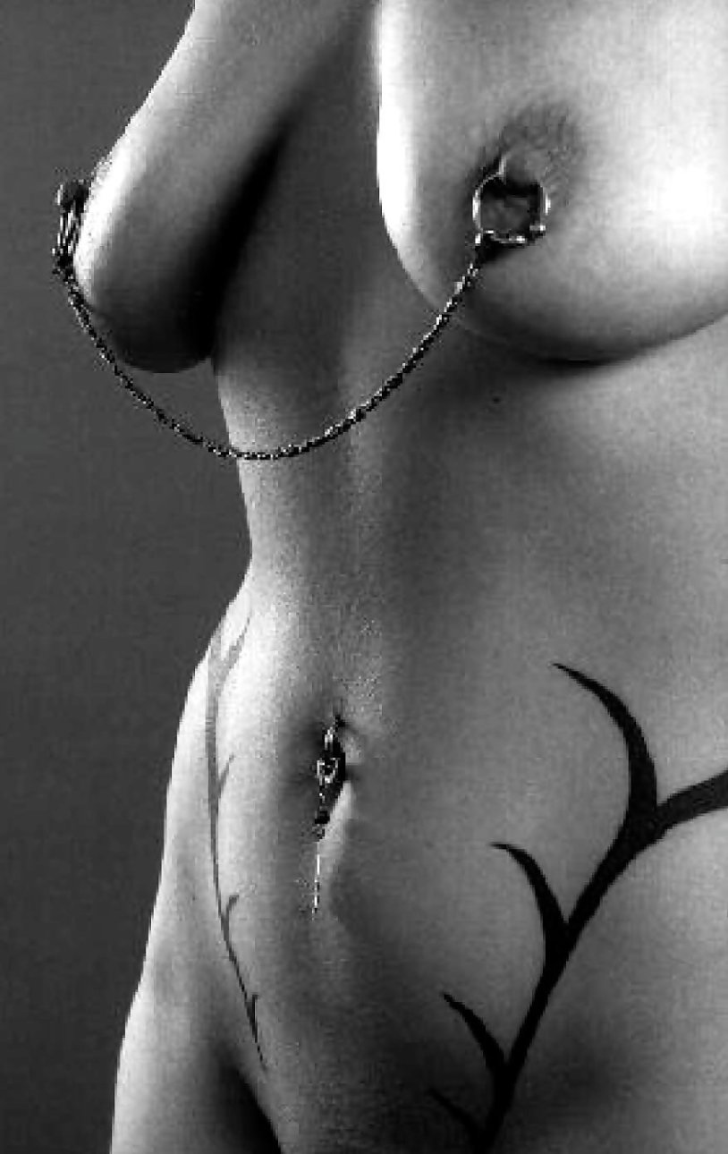 Beautiful female breasts with piercing