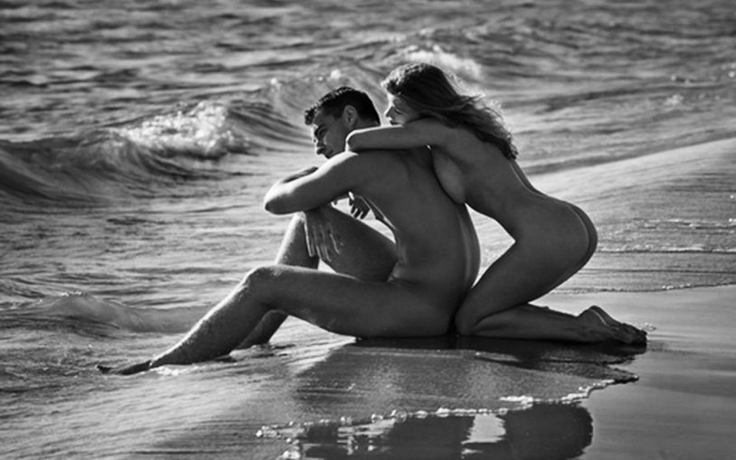Naked men and women on the beach