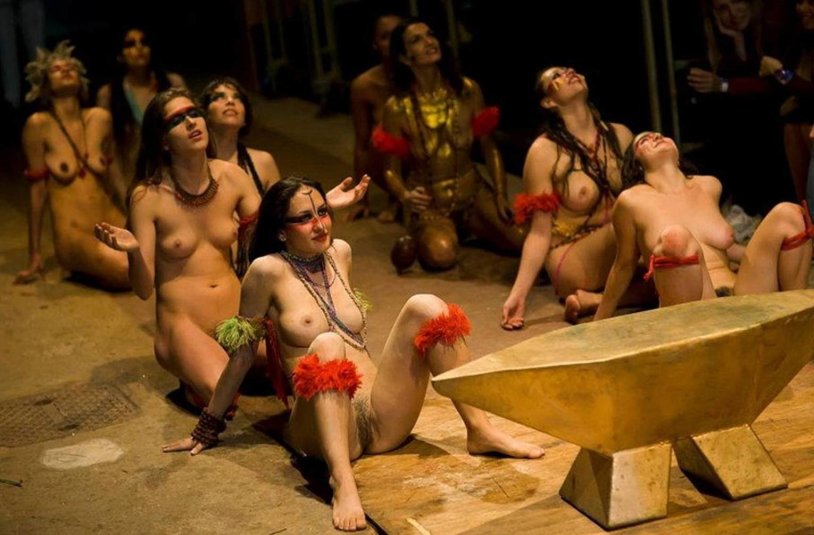 Naked actors on the stage of the theater