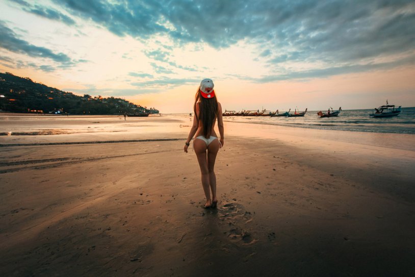 Girl against the background of the beach