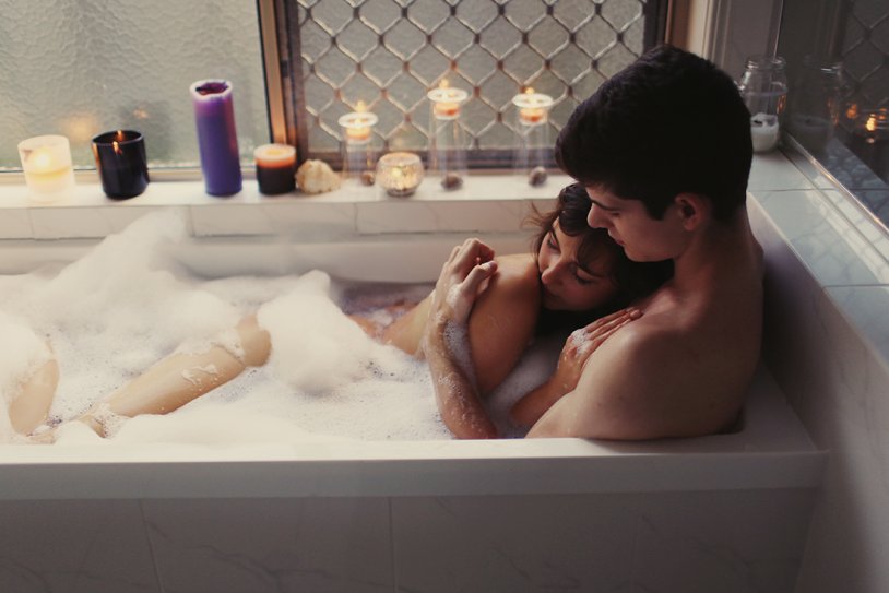A guy with a girl in a bath