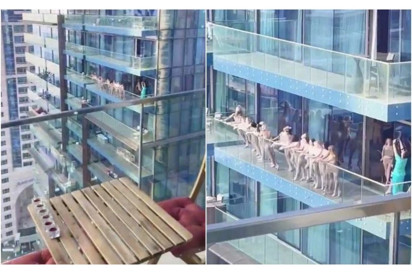 The girl undresses on the balcony