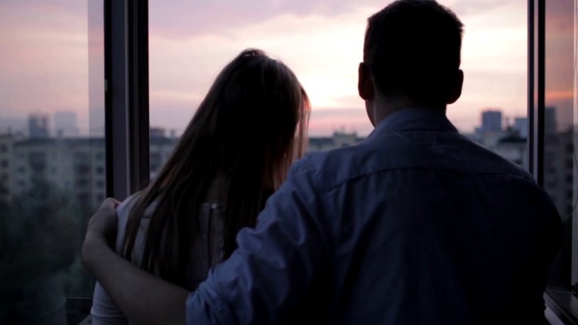 Guy and girl by the window