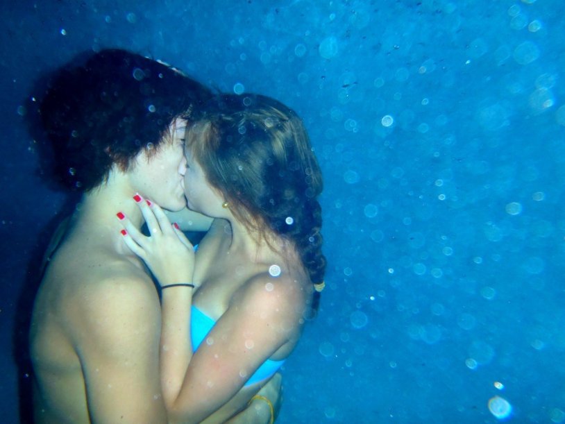 Boy and girl under water