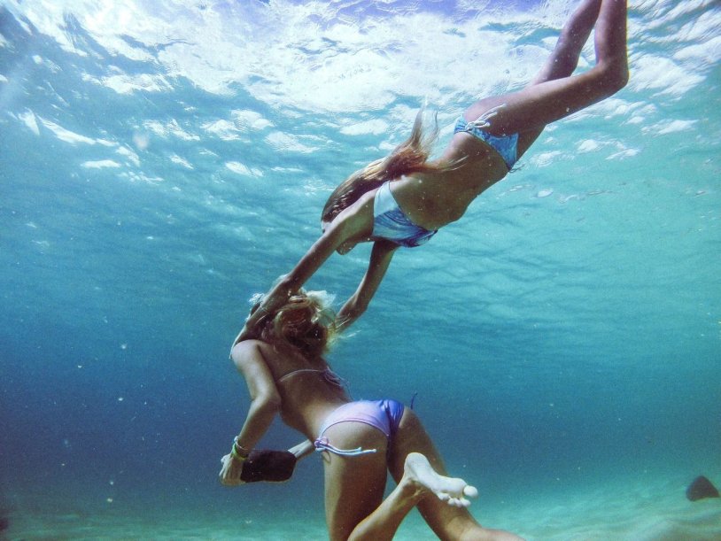 The girl dives into the pool