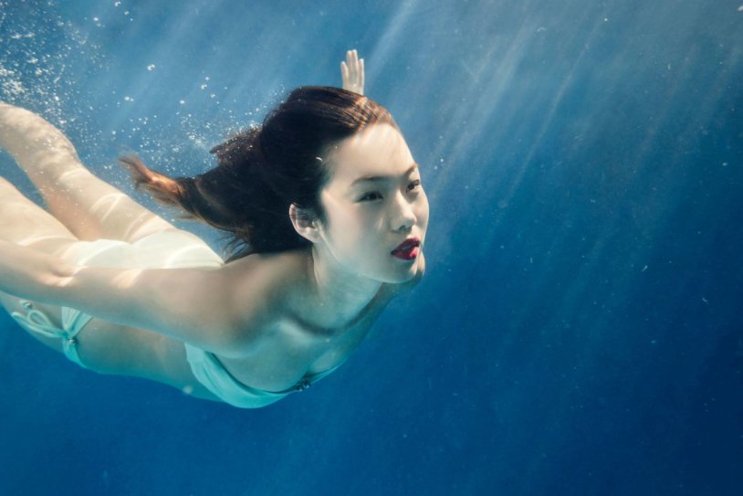 Girl swims under water
