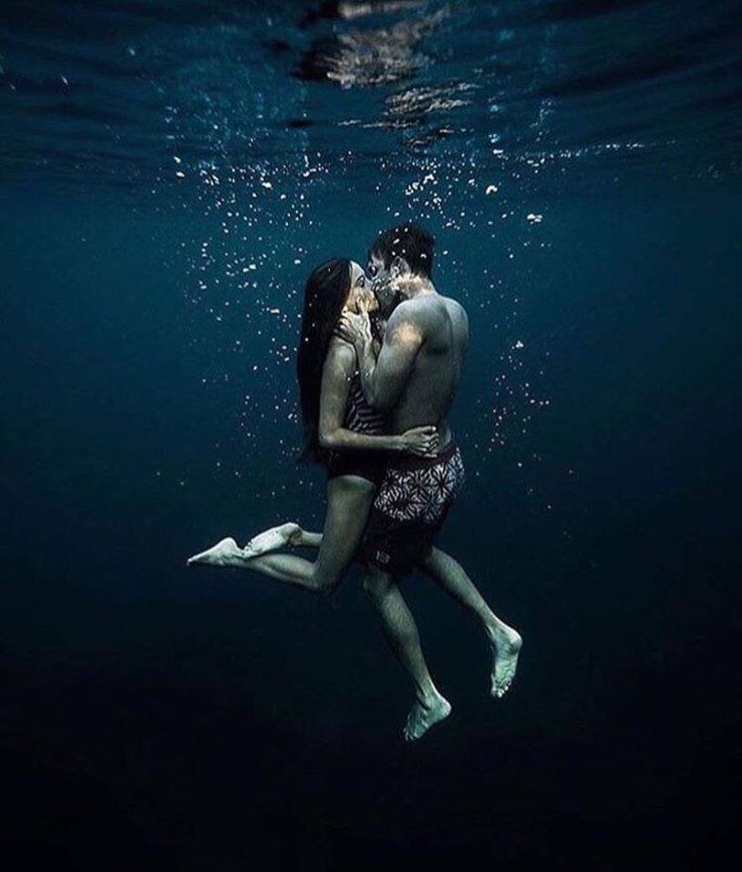 Guy and girl underwater