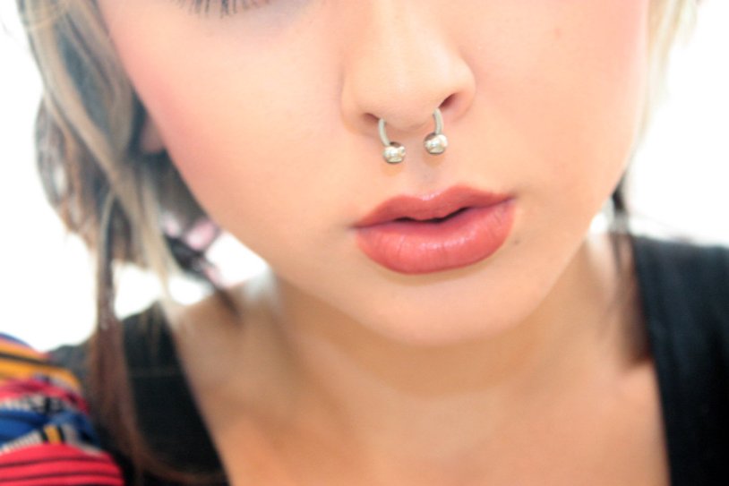 Piercing septum in the nose golden