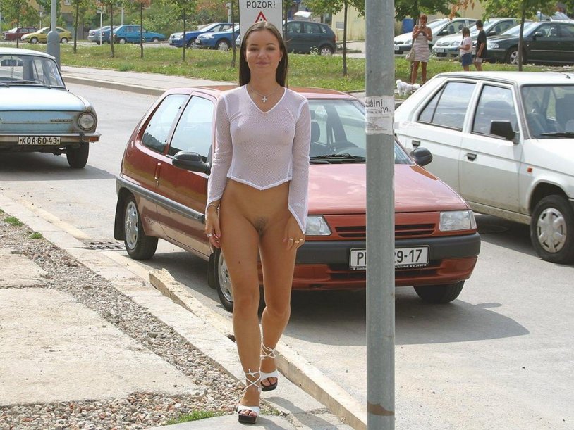 Naked woman at a party among dressed