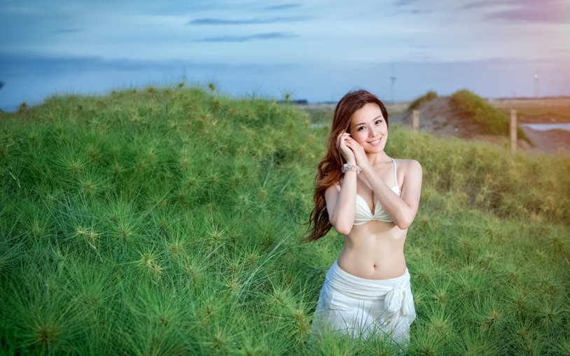 Girl in sunglasses on the beach