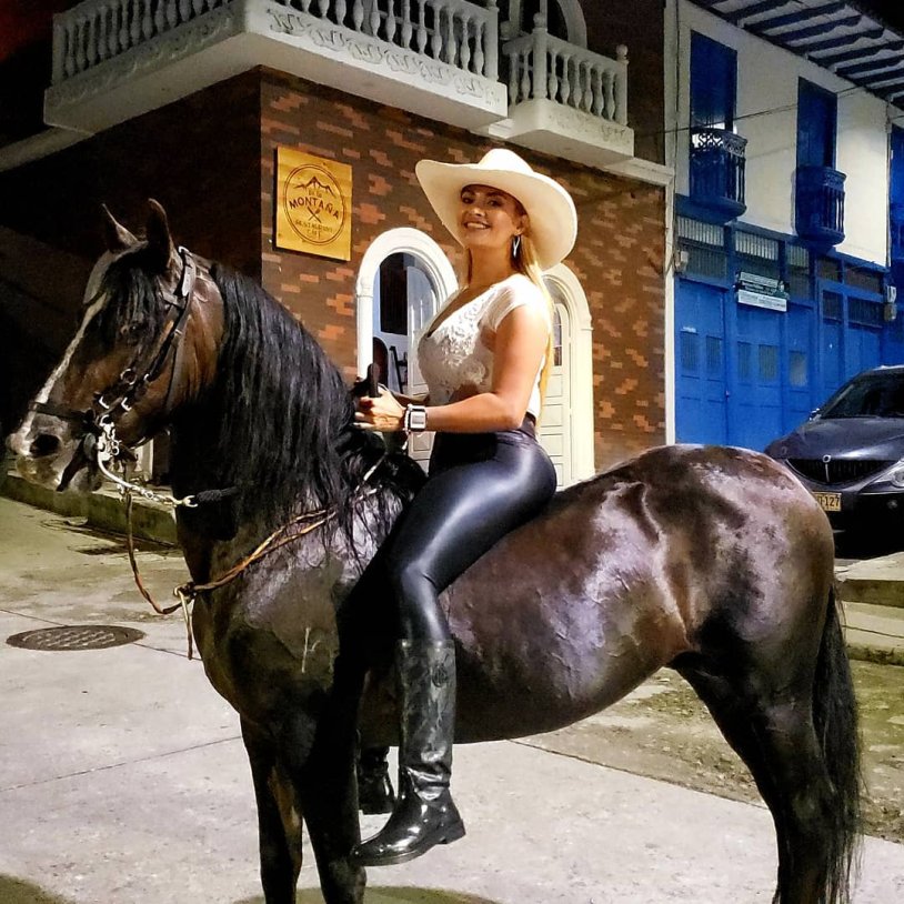 Girl Cowboy riding a horse