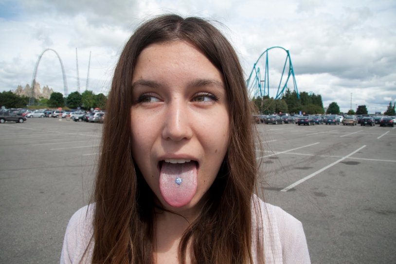 Girl with glasses blonde with her tongue sticking out