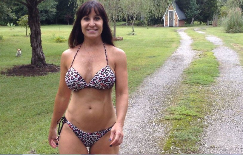 In a swimsuit in the country