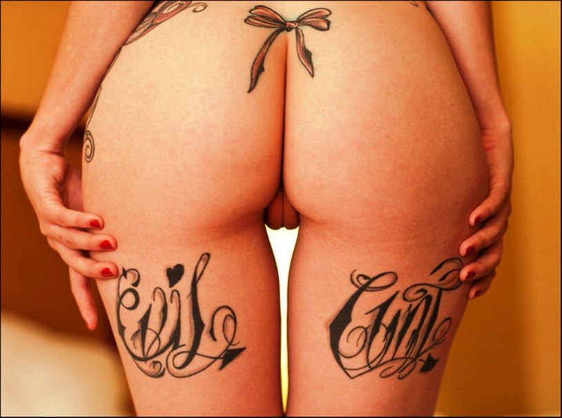Porn actress with a tattoo on the lower back