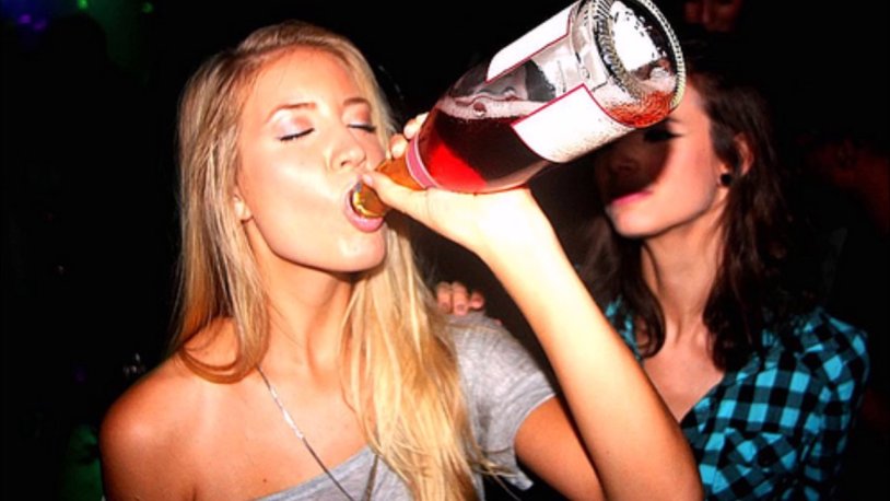 A man with a bottle in his hand