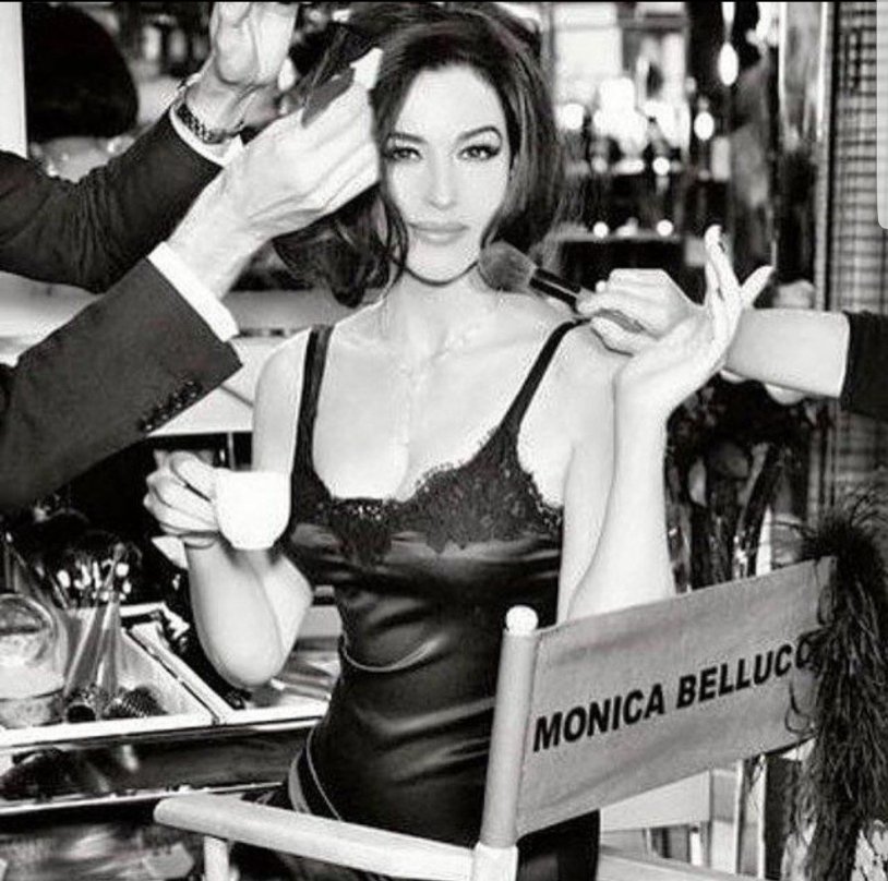 Monica Bellucci drinks coffee