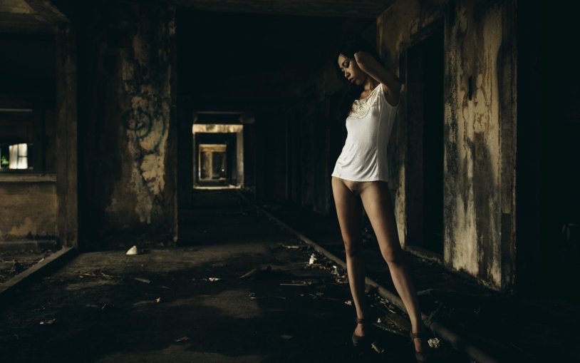 A girl undresses in the background