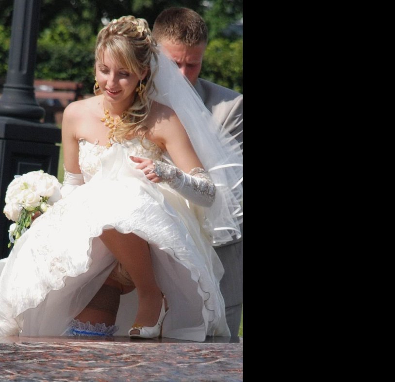 The bride lifted up a dress