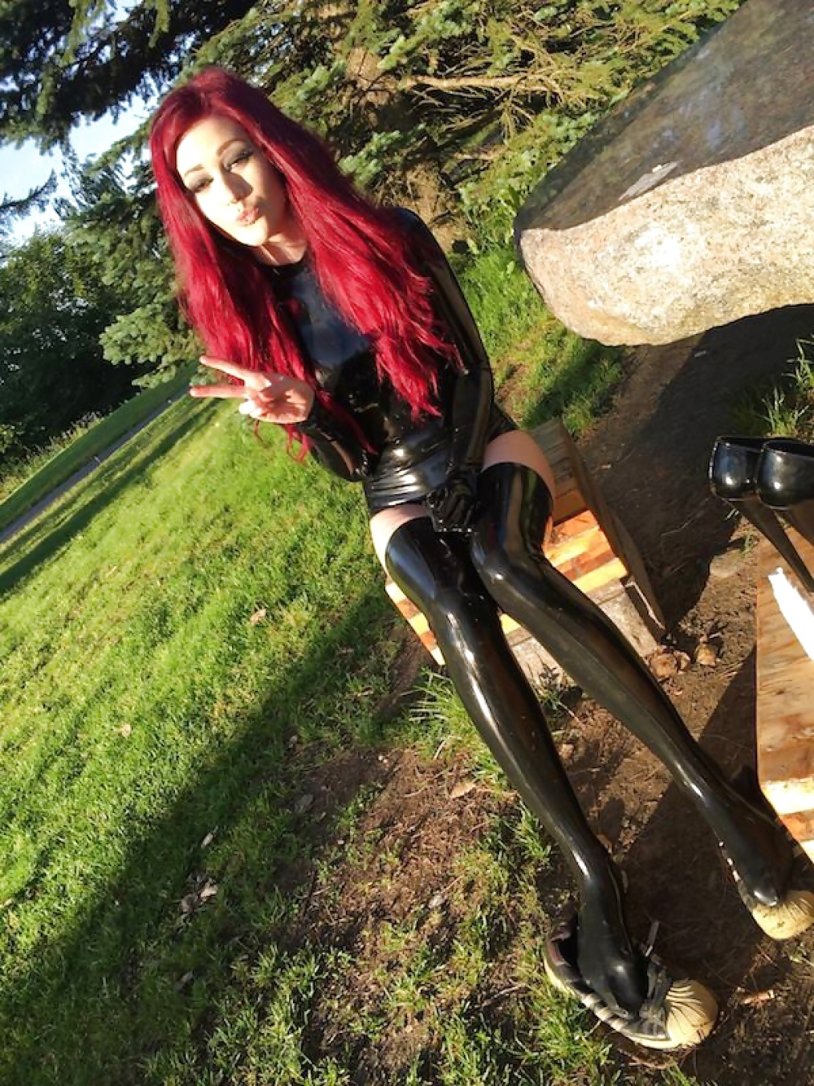 Red -haired girls in latex