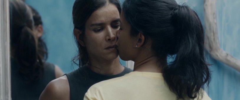 Girls on the beach kiss