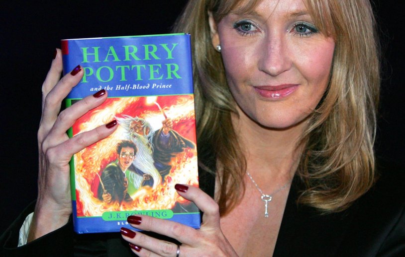 Joan Rowling with Harry Potter's book
