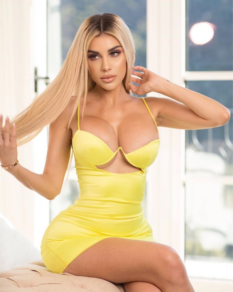 Nikki Dlano in a dress