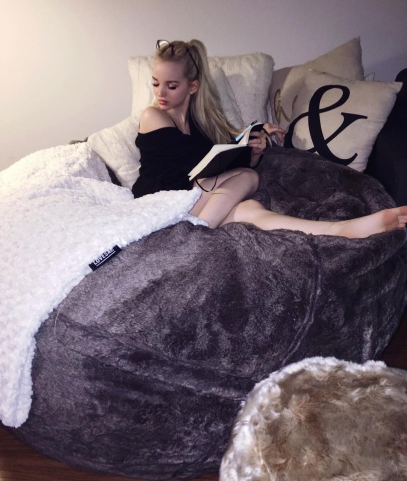 Sabrina Carpenter on the bed
