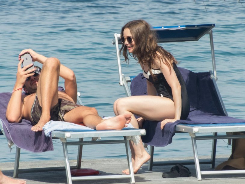 Lily Collins Paparazzi on the beach