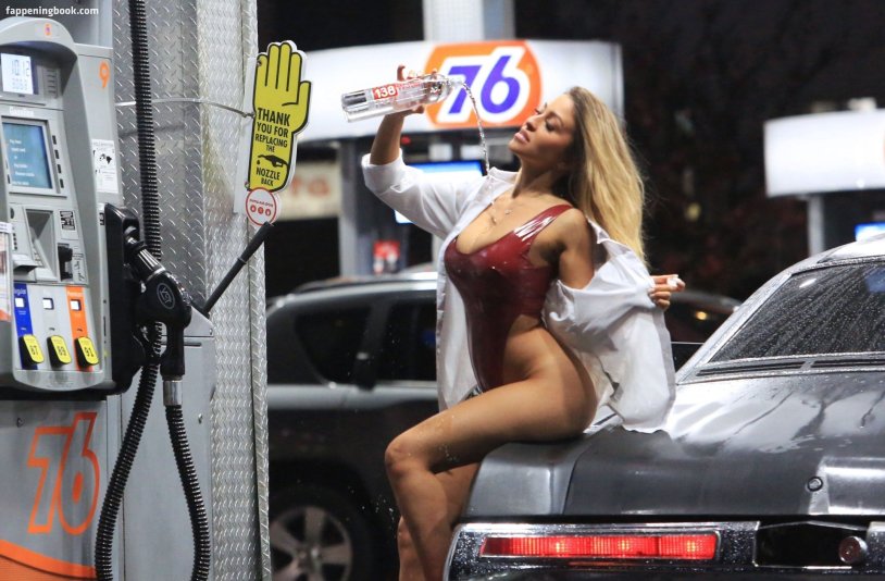 Beautiful girl on a gas station