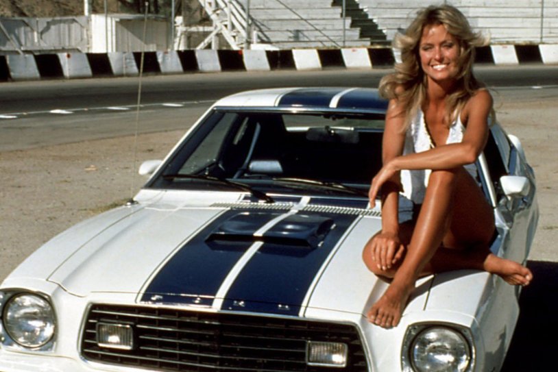 Farra Fosett in a red swimsuit