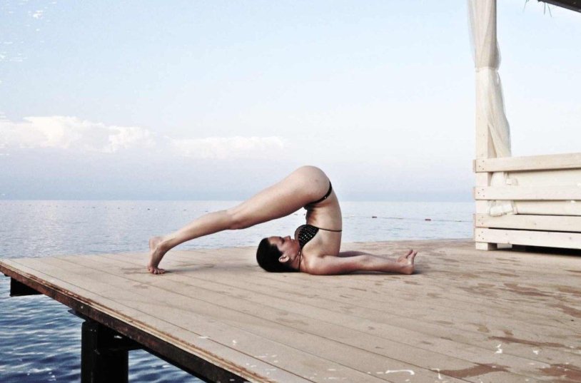 Yoga in a swimsuit and naked