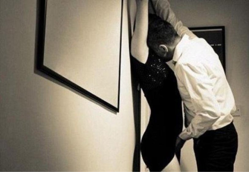 The guy pressed the girl against the wall