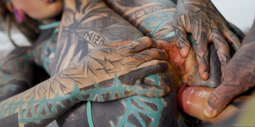 Fisting with a tattooed hand