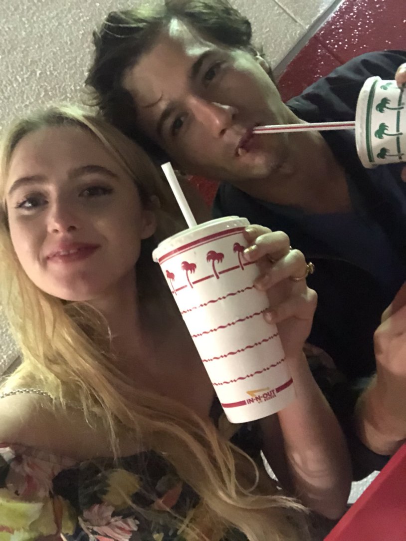 The man pressed the girl against the wall